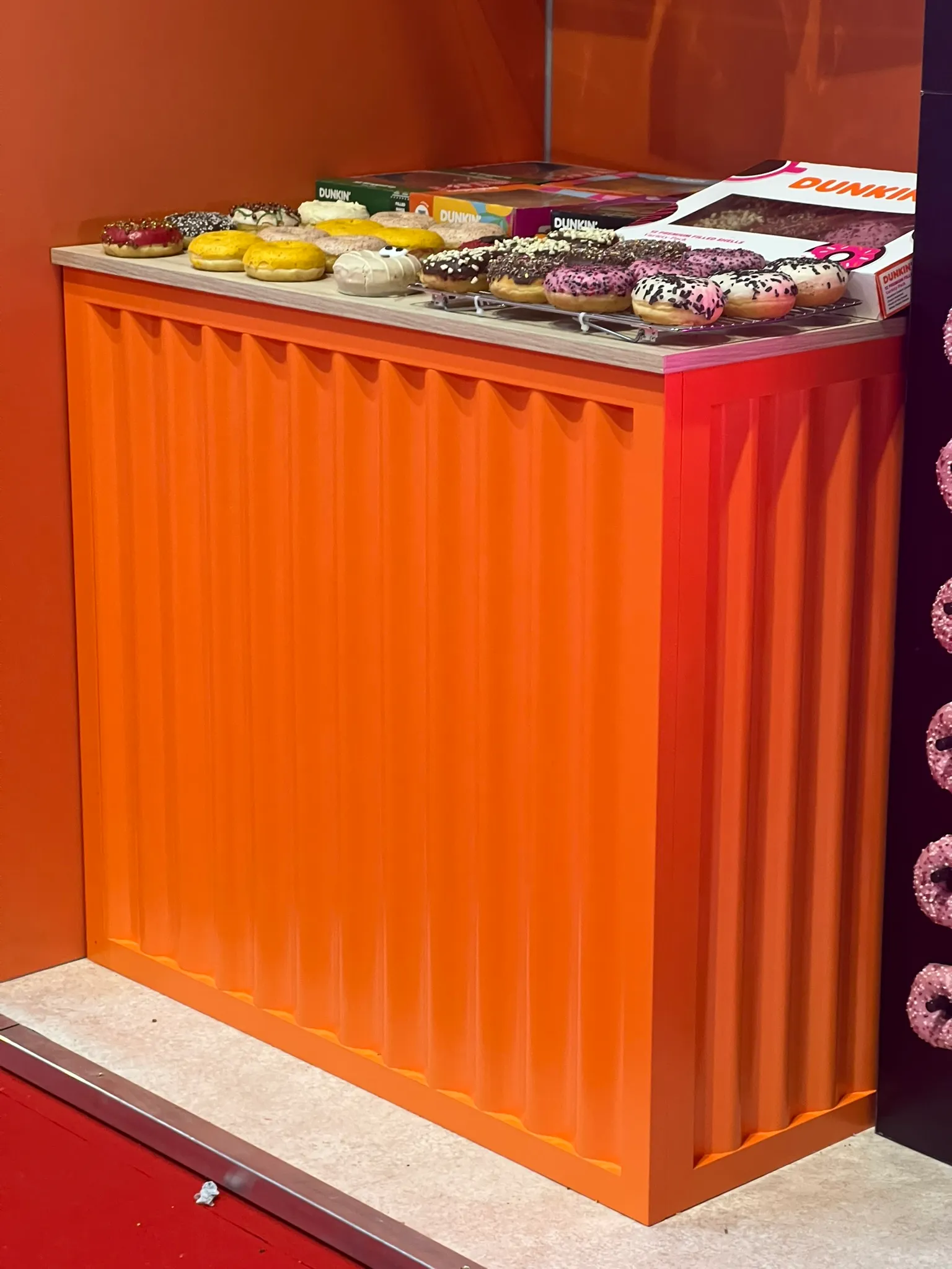 Bespoke spray finished wall panelling for Dunkin Donuts